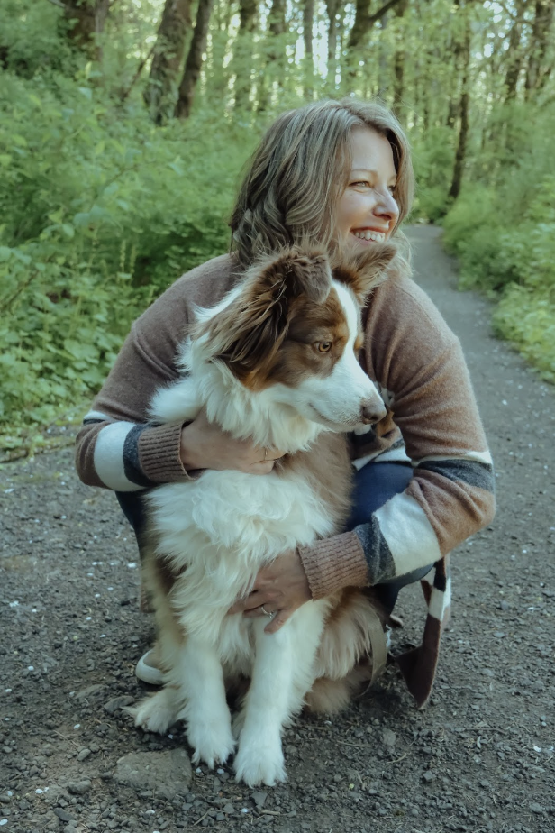 Michelle hugging Maggie her Australian Shepherd